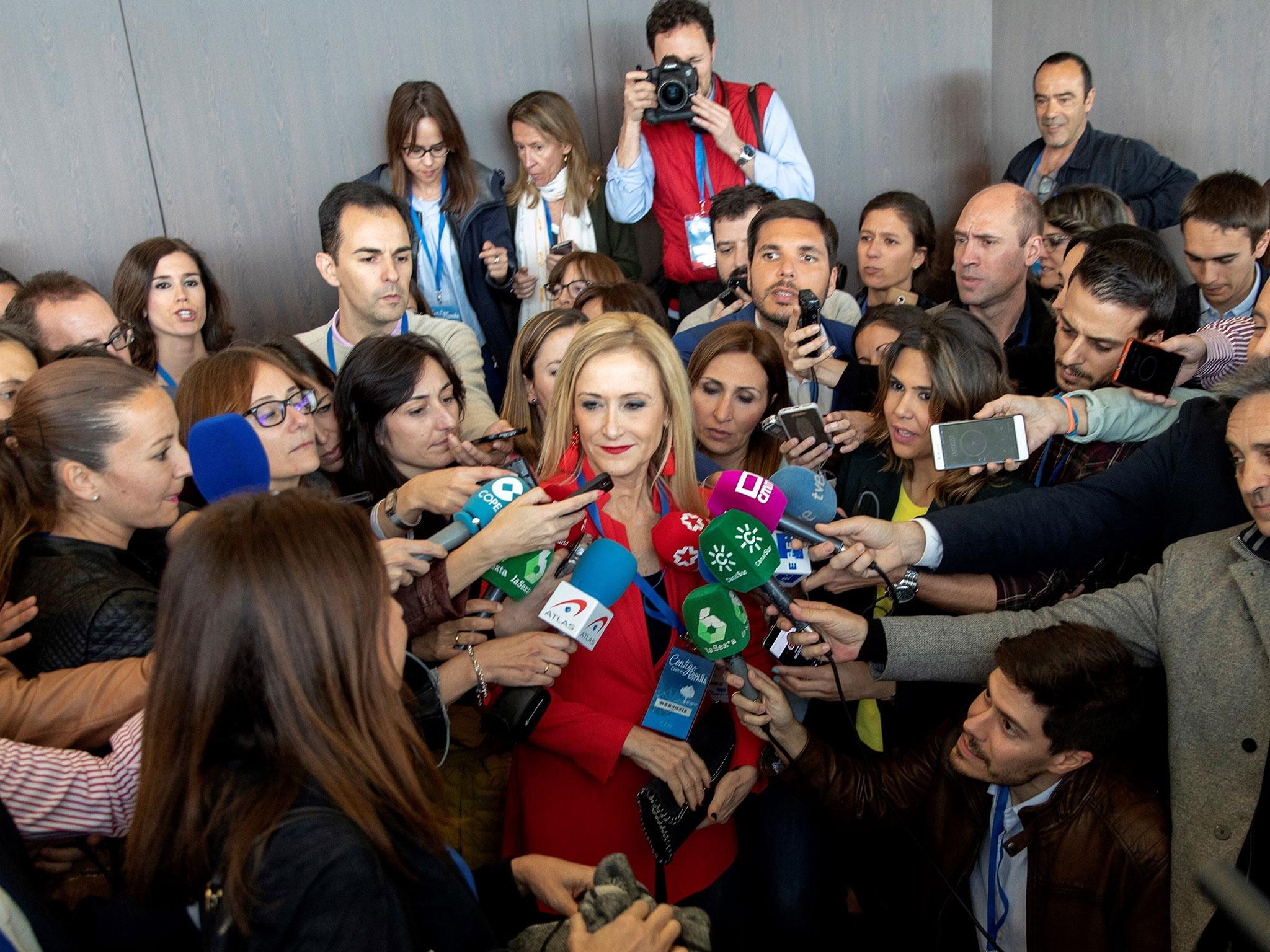 Madrid's regional President Cristina Cifuentes speaks to the media during the party's annual conference in Seville