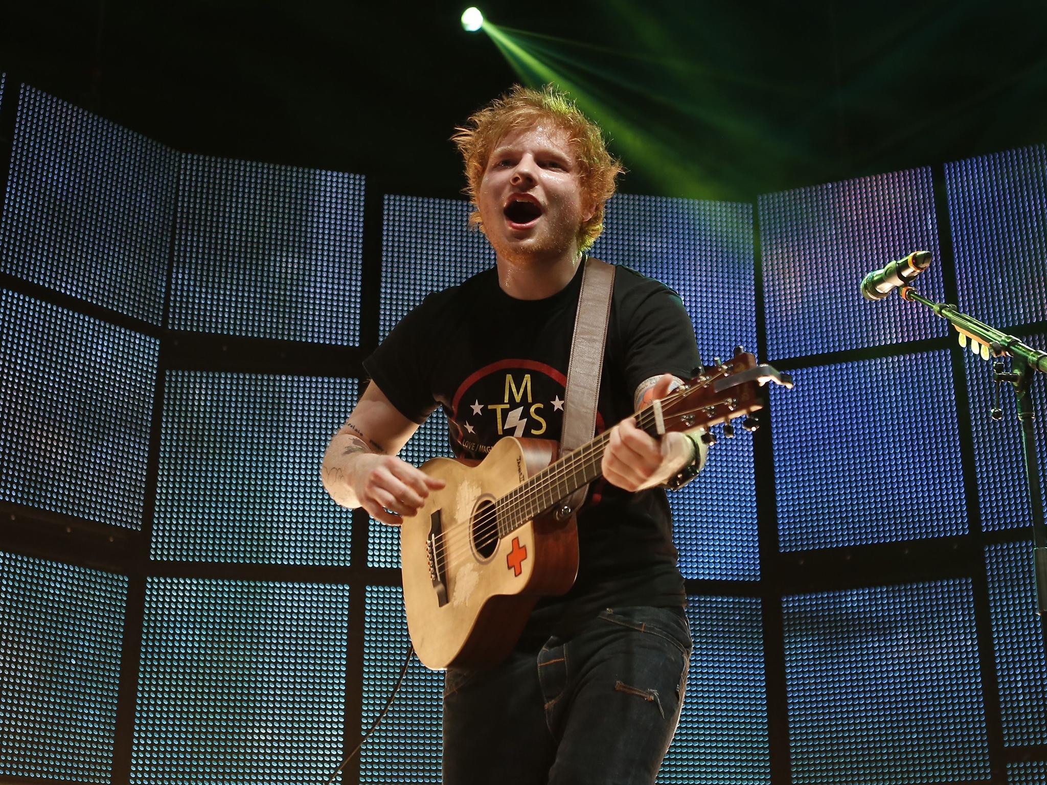 With his tatty T-shirts and high-street jeans, Sheeran has pioneered the lad-from-up-the-road look (Rex)