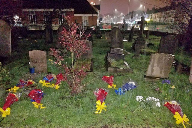 Floral tributes to Henry Vincent, which were removed from South Park Crescent in Hither Green and placed in a graveyard