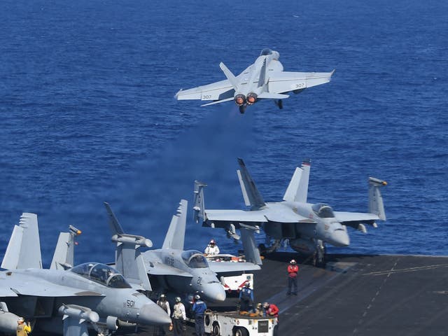In the span of 20 minutes, 20 F-18 fighter jets took off and landed on the USS Theodore Roosevelt