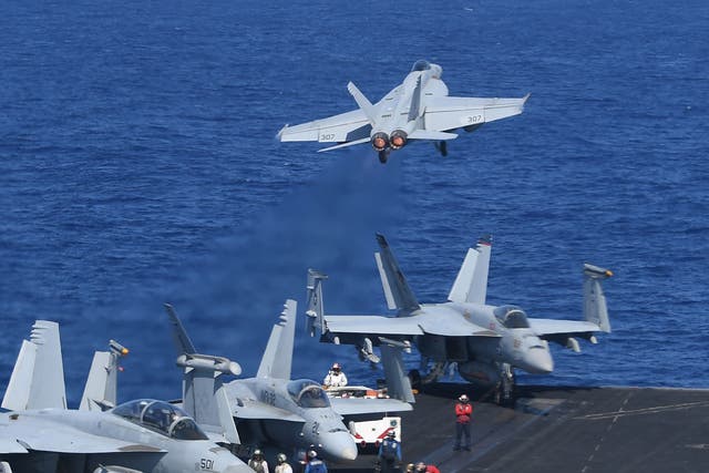 In the span of 20 minutes, 20 F-18 fighter jets took off and landed on the USS Theodore Roosevelt