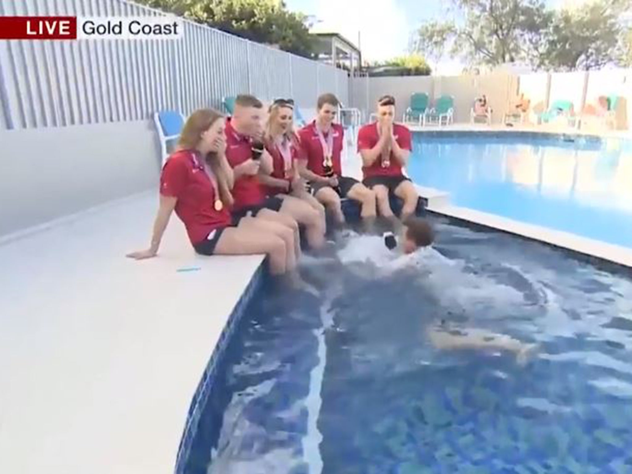 Bushell fell into a swimming pool while attempting to interview members of Team England