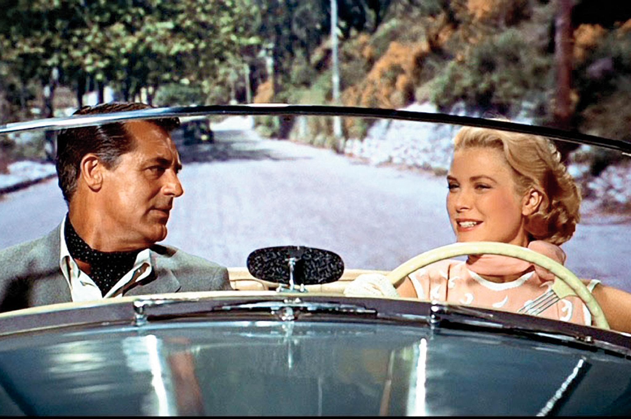 Cary Grant and Grace Kelly chatting in To Catch a Thief, 1955: what’s that curved thing in her hand?