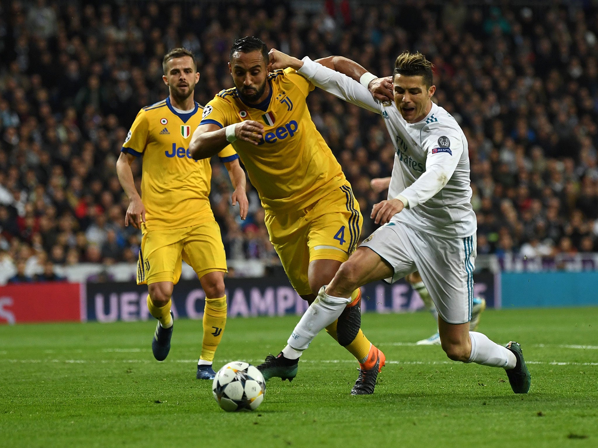 Cristiano Ronaldo and Medhi Benatia tussle for possession