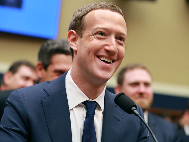 Mark Zuckerberg smiles at the conclusion of his testimony before the House Energy and Commerce Committee.