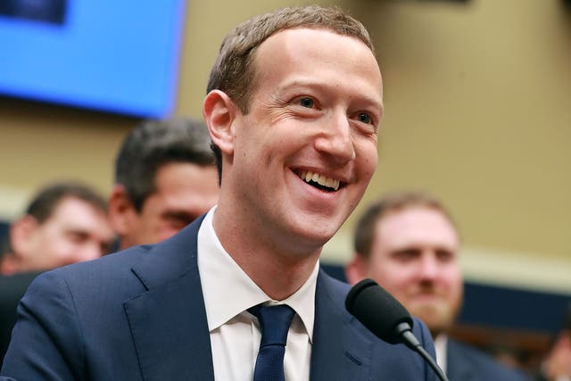 Mark Zuckerberg smiles at the conclusion of his testimony before the House Energy and Commerce Committee.