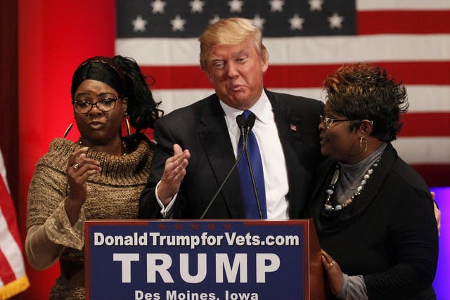 Diamond and Silk with Donald Trump on the campaign trail in Des Moines, Iowa, on 28 January 28 2016