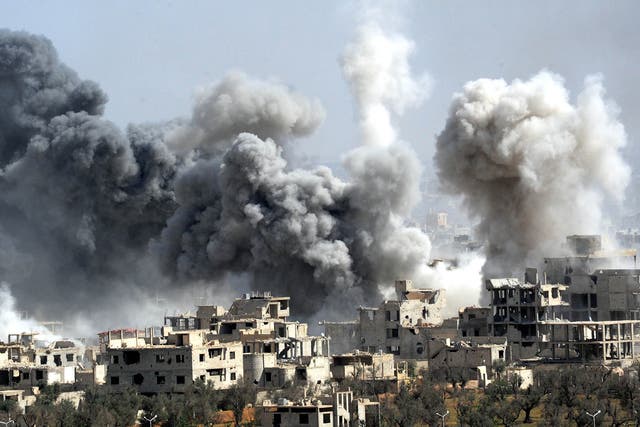 Smoke rises after the Syrian army's shelling targeted the Douma district in Eastern Ghouta