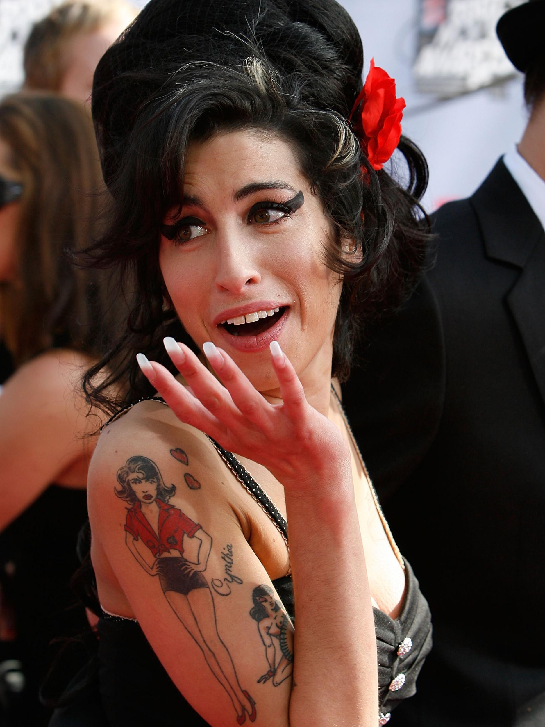 Amy Winehouse had the figure of an archetypal, bare-breasted pin-up tattooed on one arm. ‘Girl’ – the woman she felt she could never be. A cartoon woman