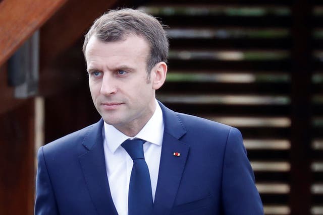 French President Emmanuel Macron arrives at an elementary school to attend a one-hour interview with French news channel TF1, in Berd'huis, France