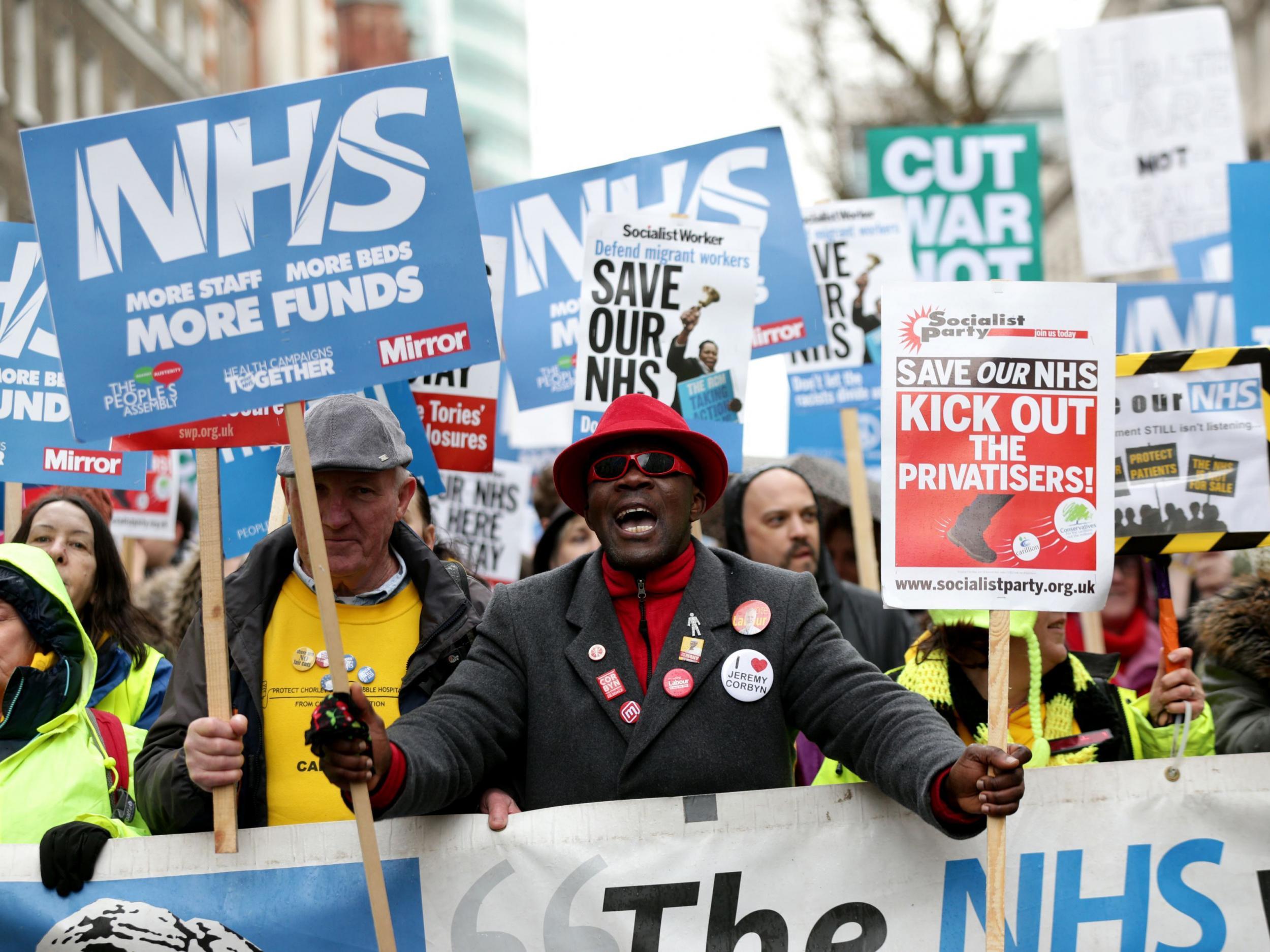 Demonstrators take part in a march in London in February in support of the NHS