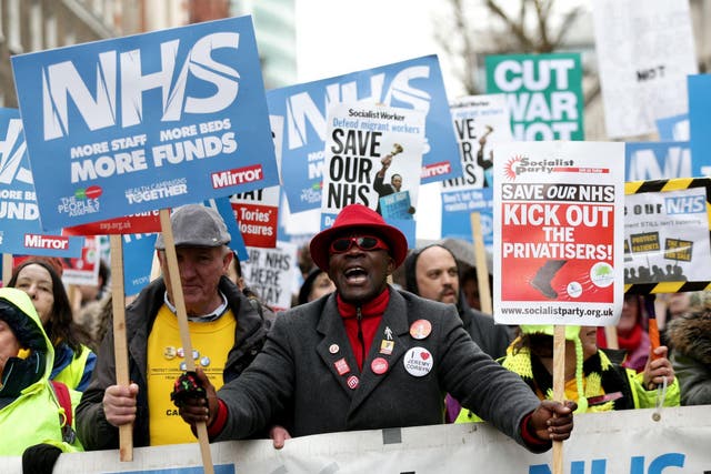 Demonstrators take part in a march in London in February in support of the NHS
