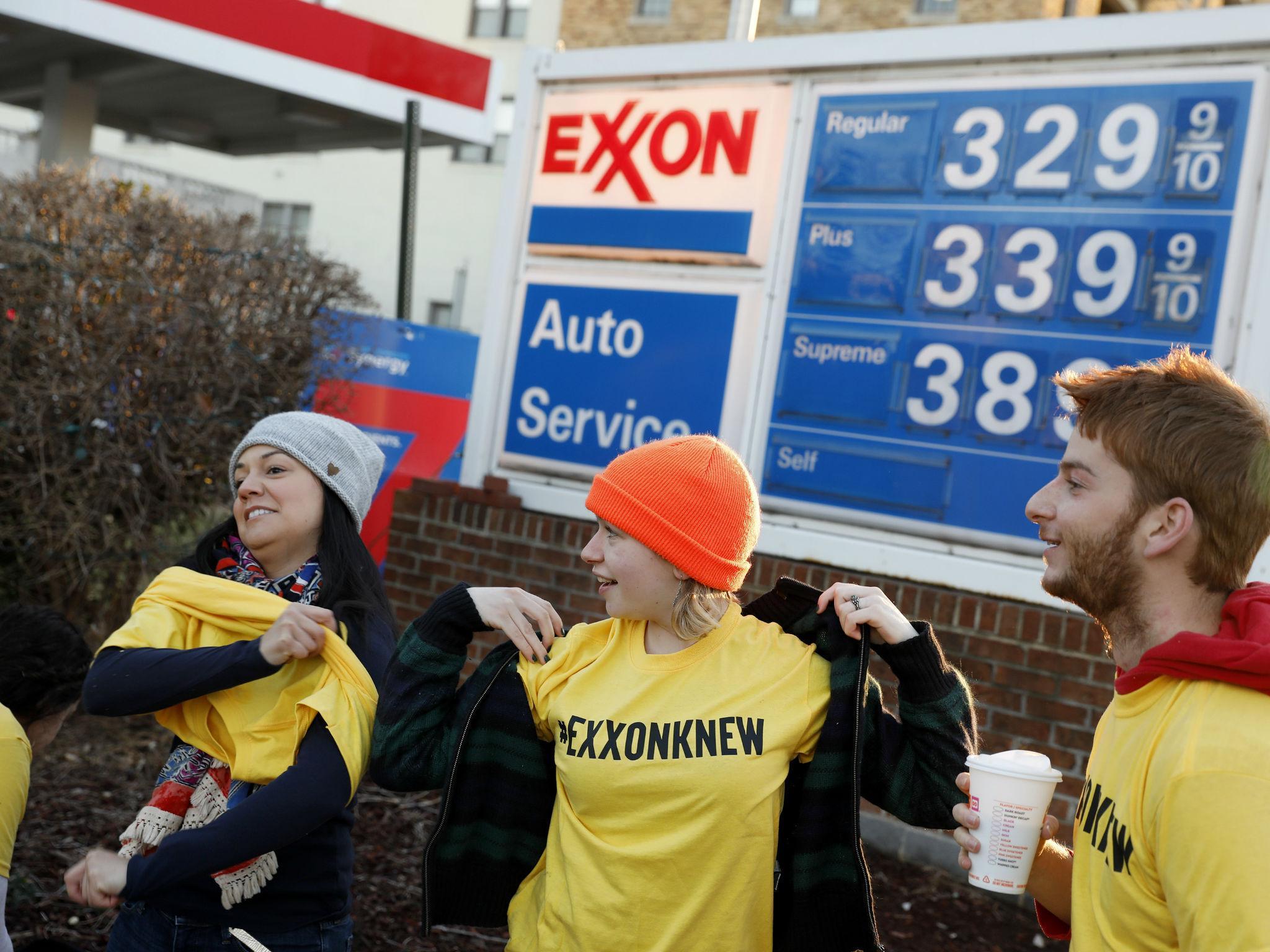 Protesters are pictured near an Exxon gas station in Washington in 2017