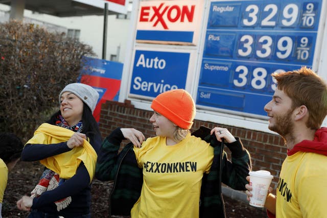 Protesters are pictured near an Exxon gas station in Washington in 2017