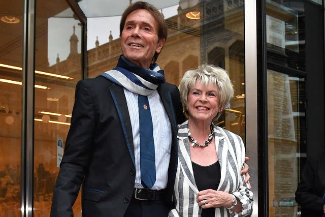 Sir Cliff Richard leaves the Rolls Building in London with Gloria Hunniford, where he gave evidence in a legal battle against the BBC