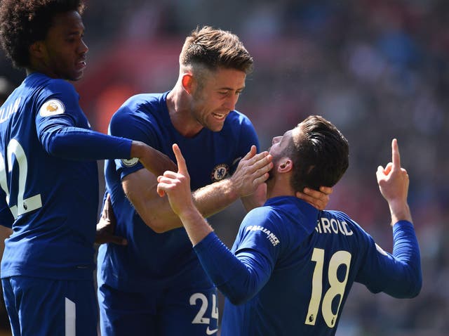Olivier Giroud is embraced after scoring his winning goal