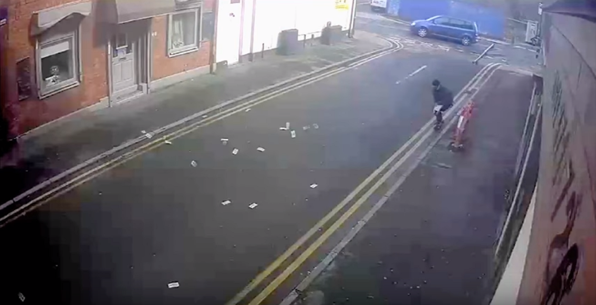 Greater Manchester Police released CCTV footage of two men chasing after stolen cash after dropping it in the street in Droylsden