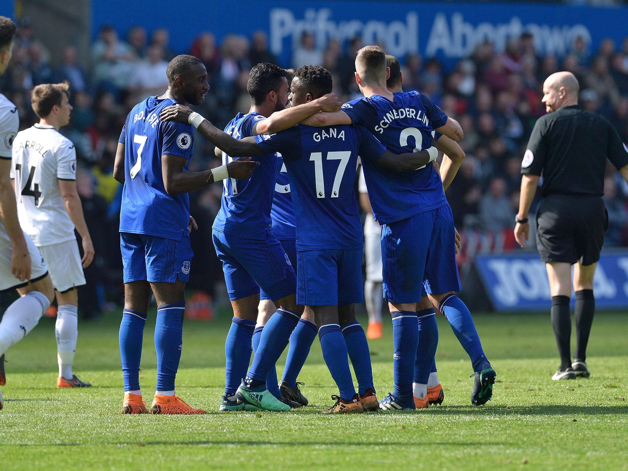Everton's players celebrate after Kyle Naughton's own goal