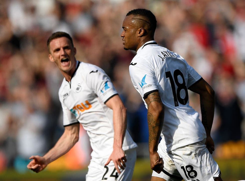 Jordan Ayew celebrates scoring the equaliser for Swansea 