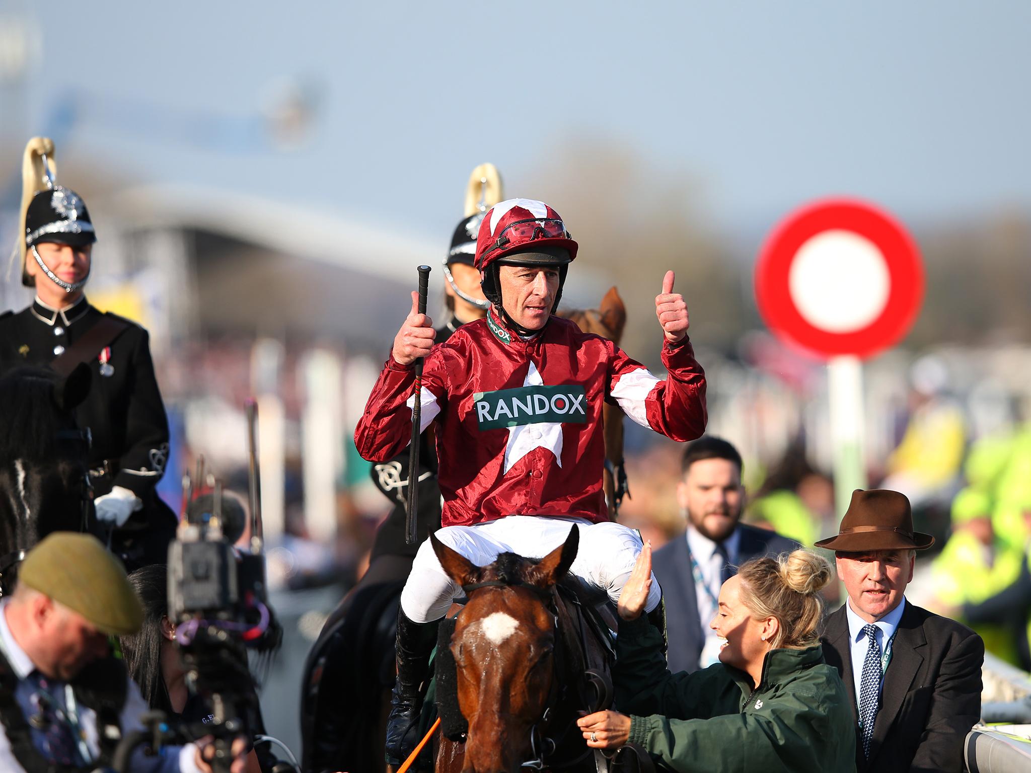 Davy Russell celebrates after being announced as the winner of the Grand National