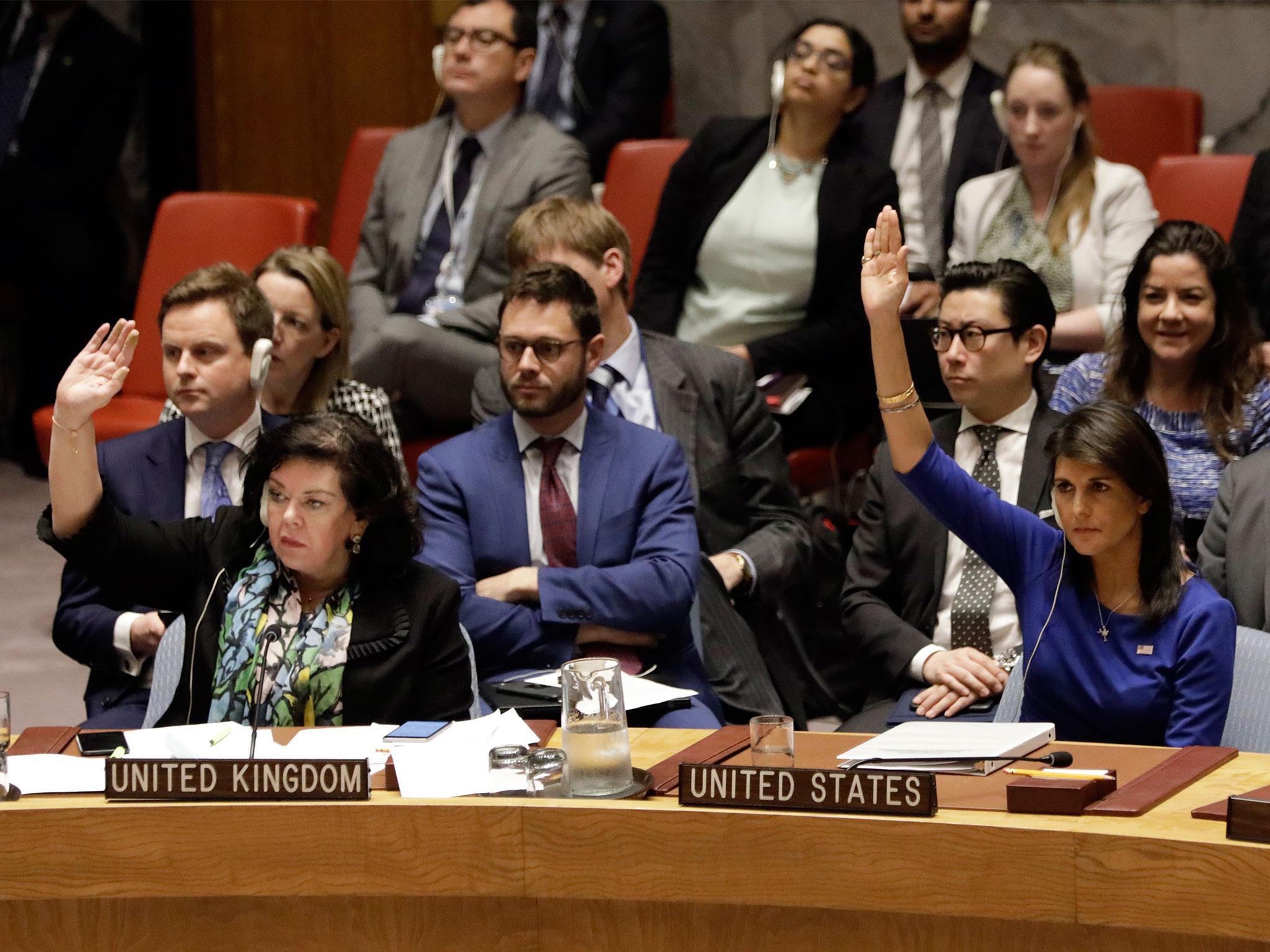 Karen Pierce, the UK’s United Nations representative, and US counterpart Nikki Haley vote at the emergency meeting on Saturday