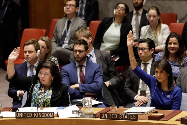 Karen Pierce, the UK’s United Nations representative, and US counterpart Nikki Haley vote at the emergency meeting on Saturday
