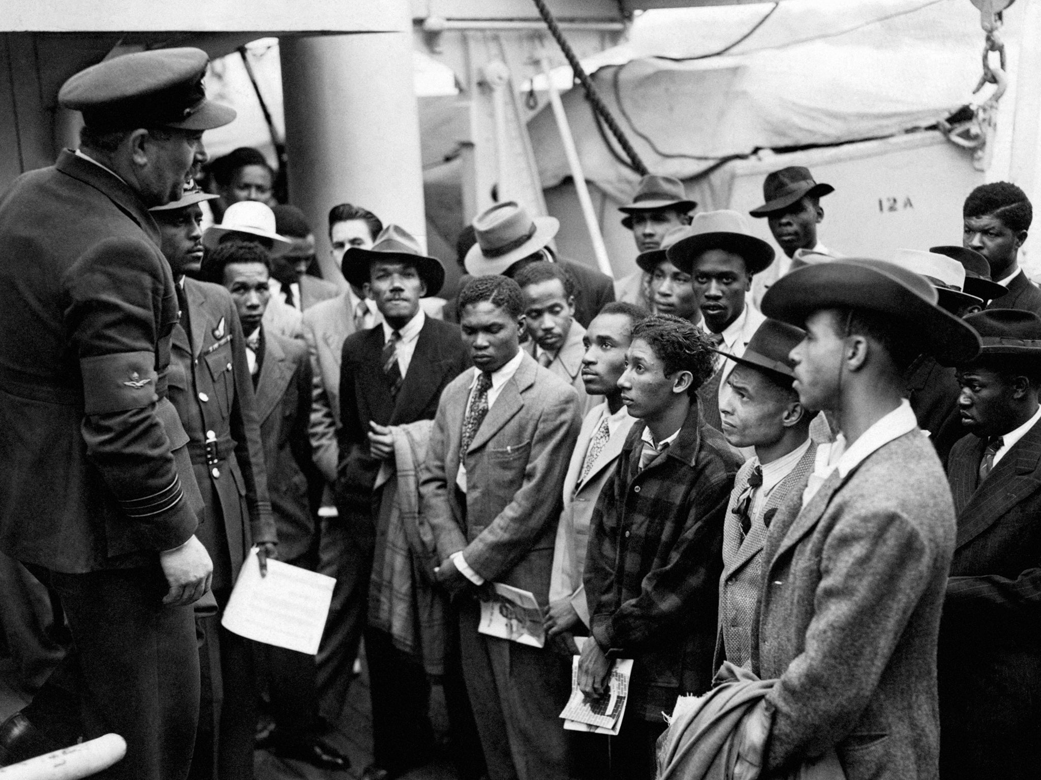 File photo dated 22/06/48 of Jamaican immigrants being welcomed by RAF officials from the Colonial Office after the ex-troopship HMT "Empire Windrush" landed them at Tilbury