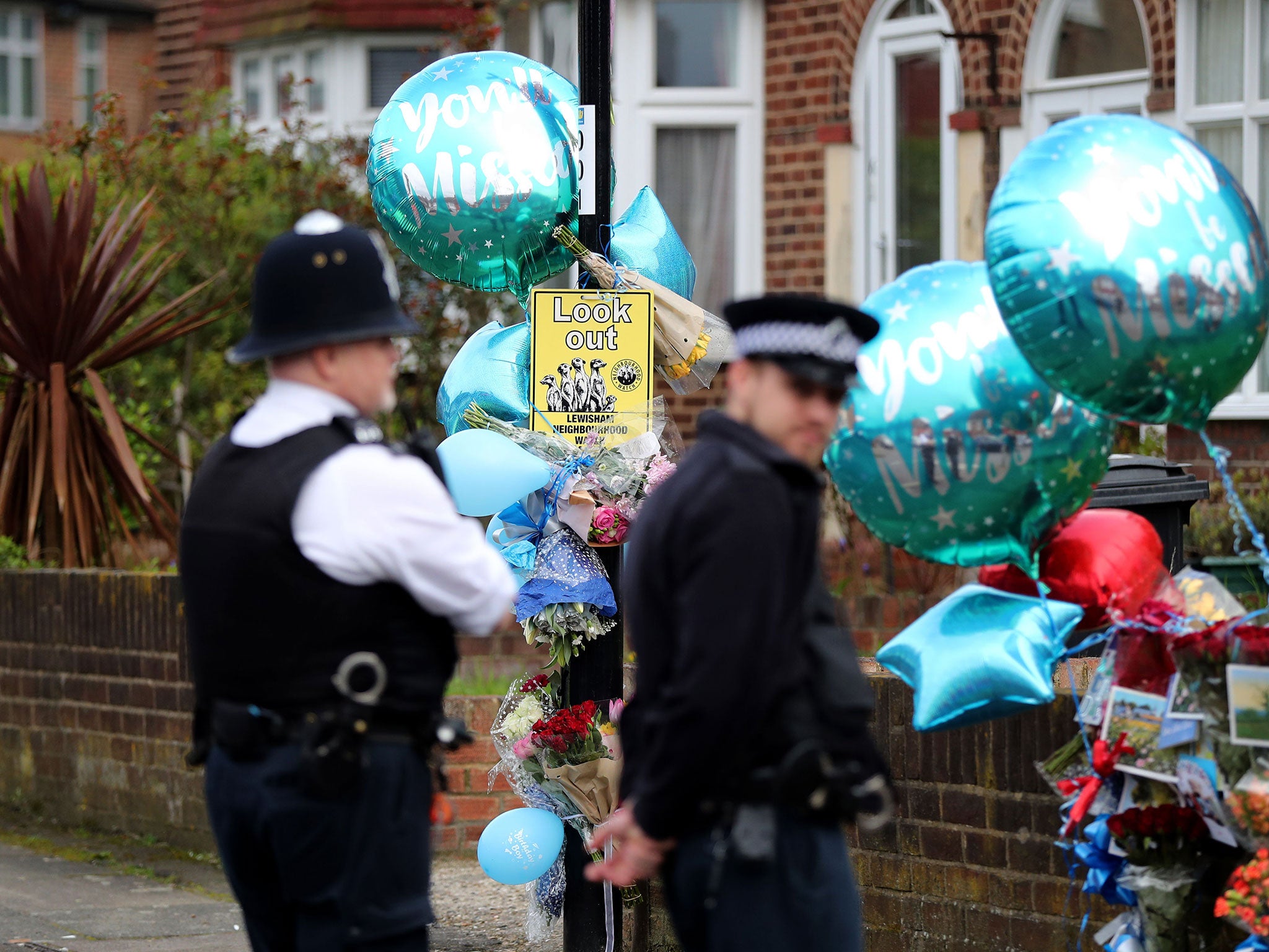 Police officers at the scene on South Park Crescent in Hither Green shortly before they were removed