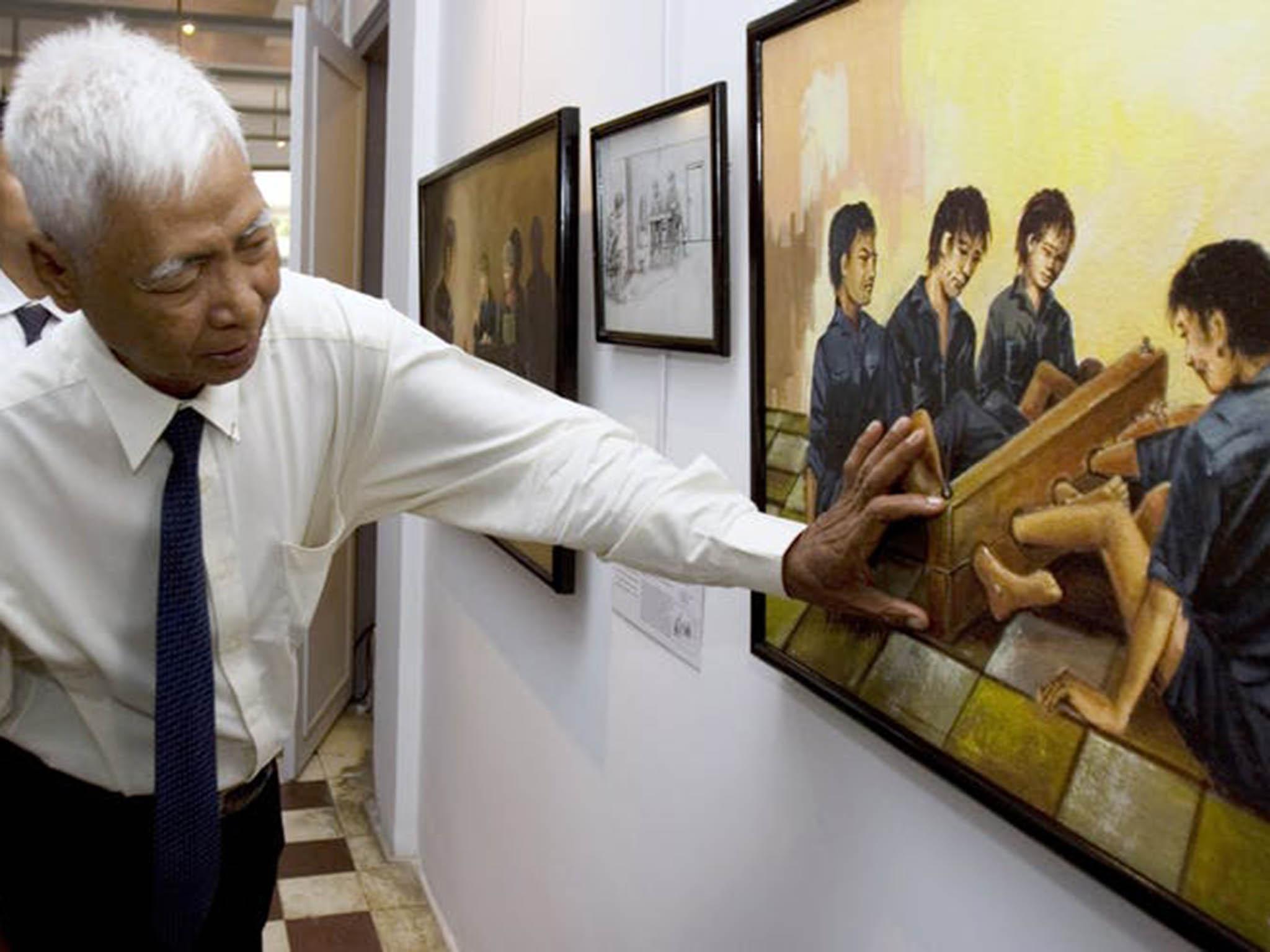 Vann Nath with his depiction of the atrocities inside Tuol Sleng