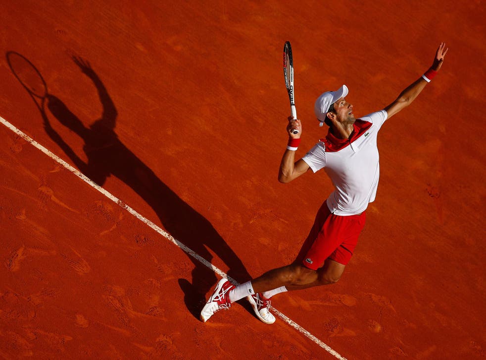 Novak Djokovic serves during his straight-sets win