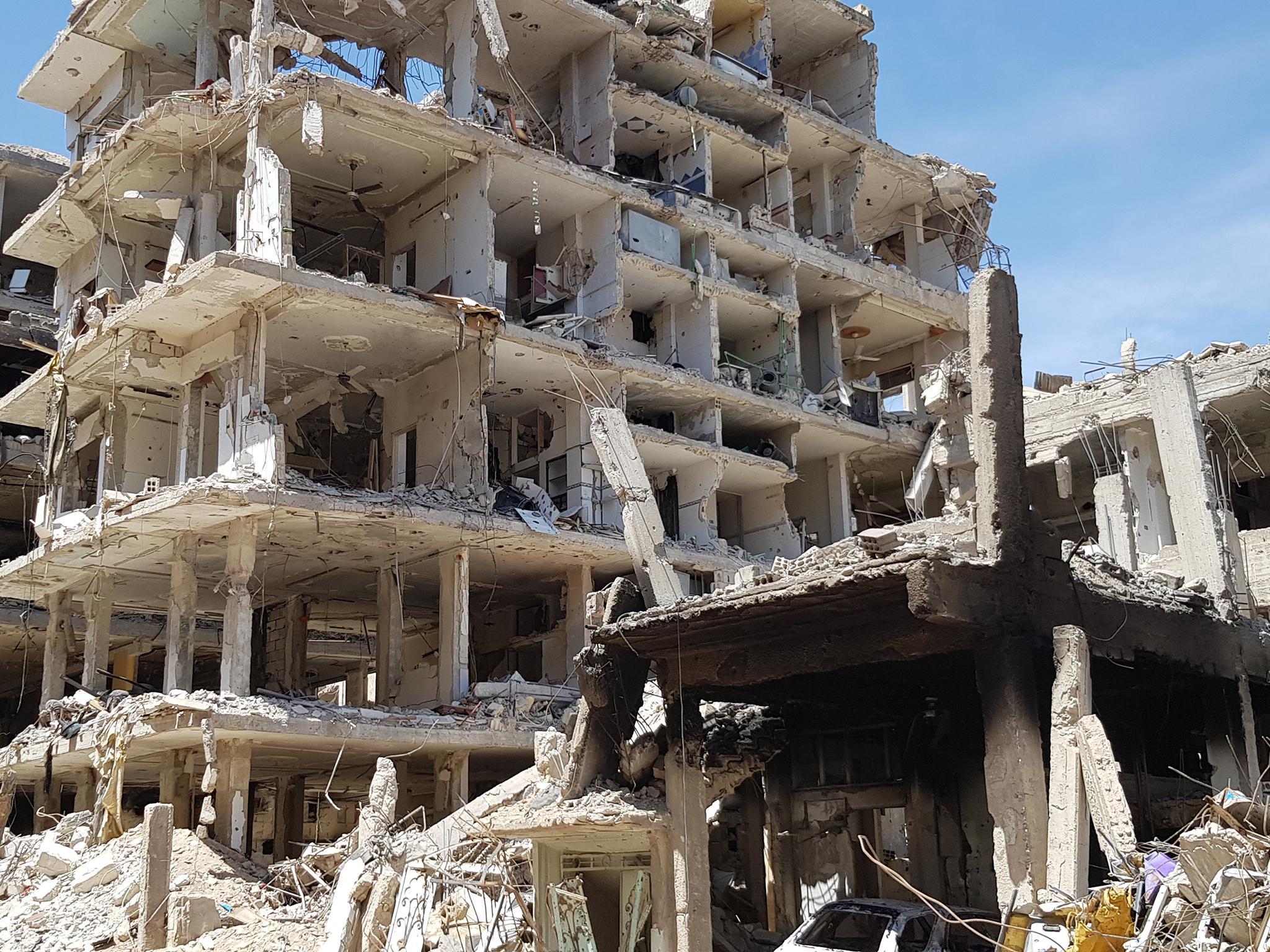 Bombed-out civilian apartments once lived in by Islamist rebels in Douma