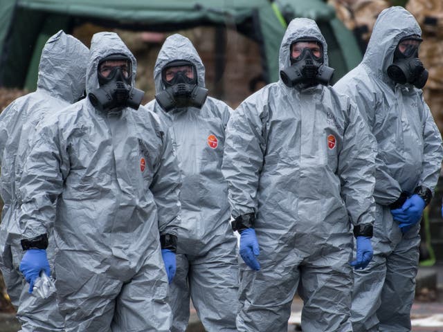 Military personnel wearing protective suits investigate the poisoning of Sergei and Yulia Skripal