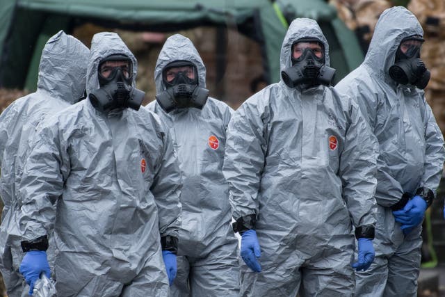 Military personnel wearing protective suits investigate the poisoning of Sergei and Yulia Skripal