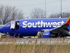 Woman 'partially pulled out of' Southwest Airlines plane in-flight