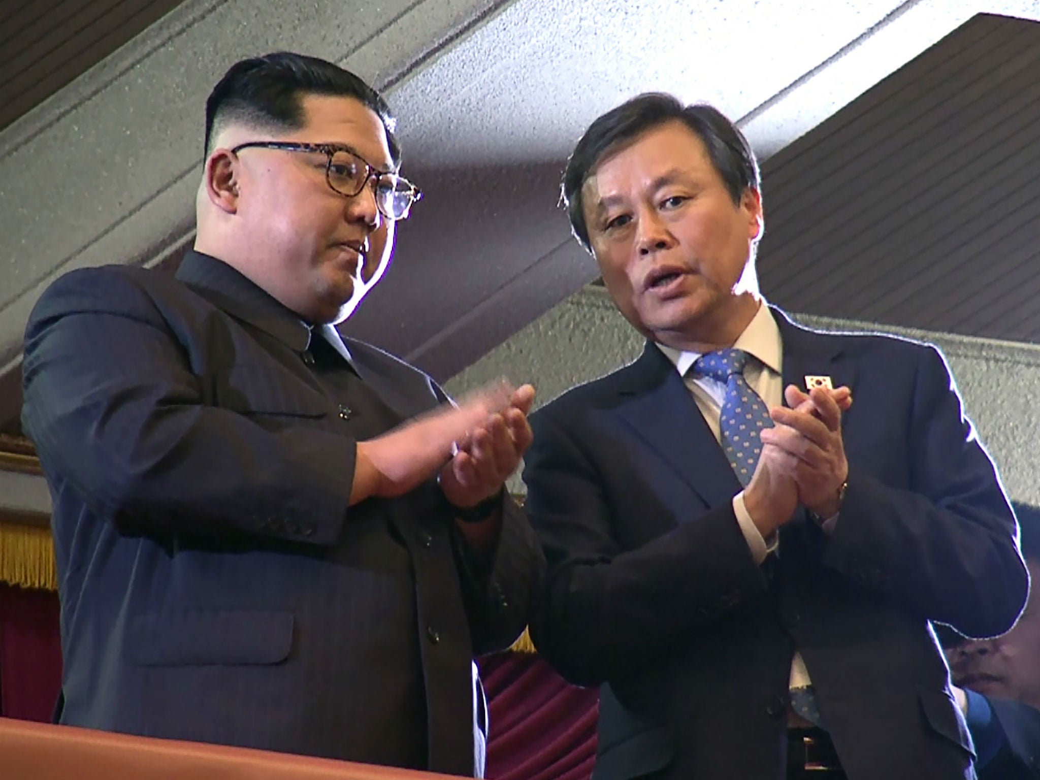 North Korean leader Kim Jong-un and South Korea's Culture, Sports and Tourism Minister Do Jong-whan during a rare concert by South Korean musicians in Pyongyang, North Korea