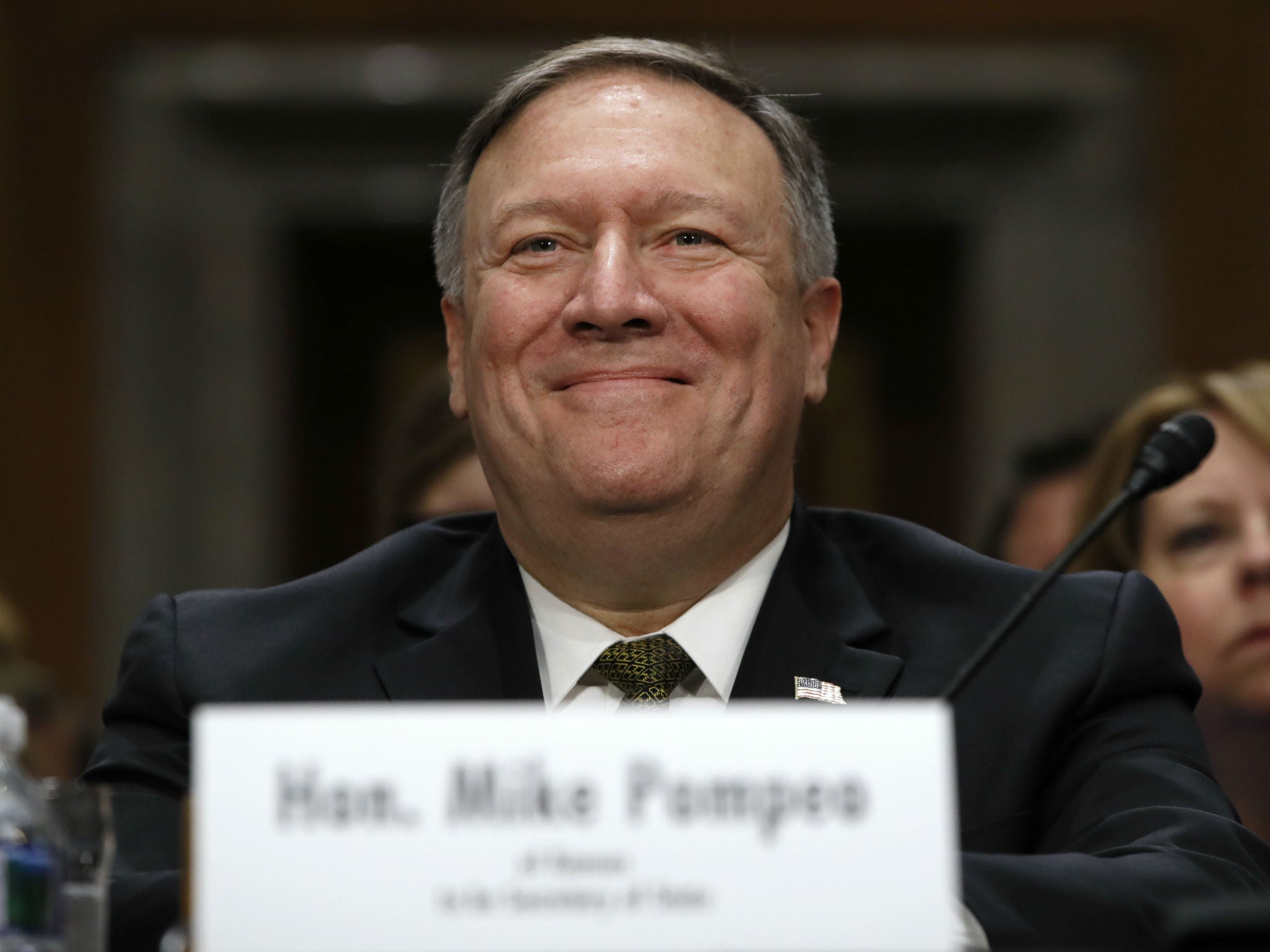 Secretary of State-designate Mike Pompeo smiles after his introduction before the Senate Foreign Relations Committee during a confirmation hearing