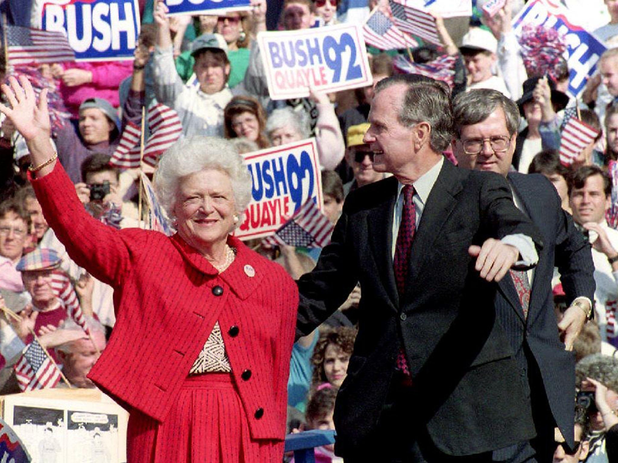 &#13;
US President George Bush and First Lady Barbara Bush wave to supporters at the 1992 campaign rally in Springfield &#13;