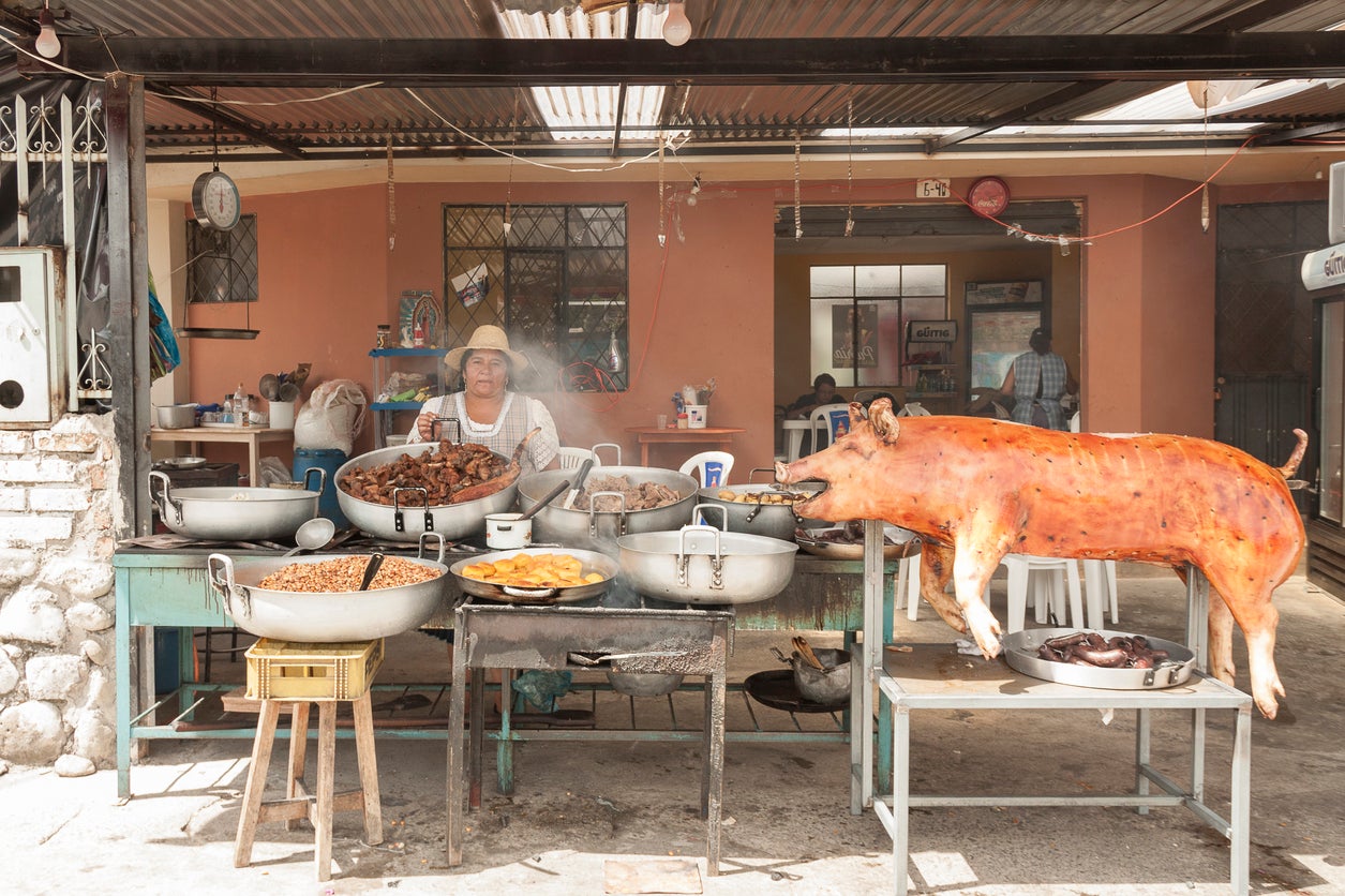 &#13;
Feast on traditional street food like pork hornado (Getty)&#13;