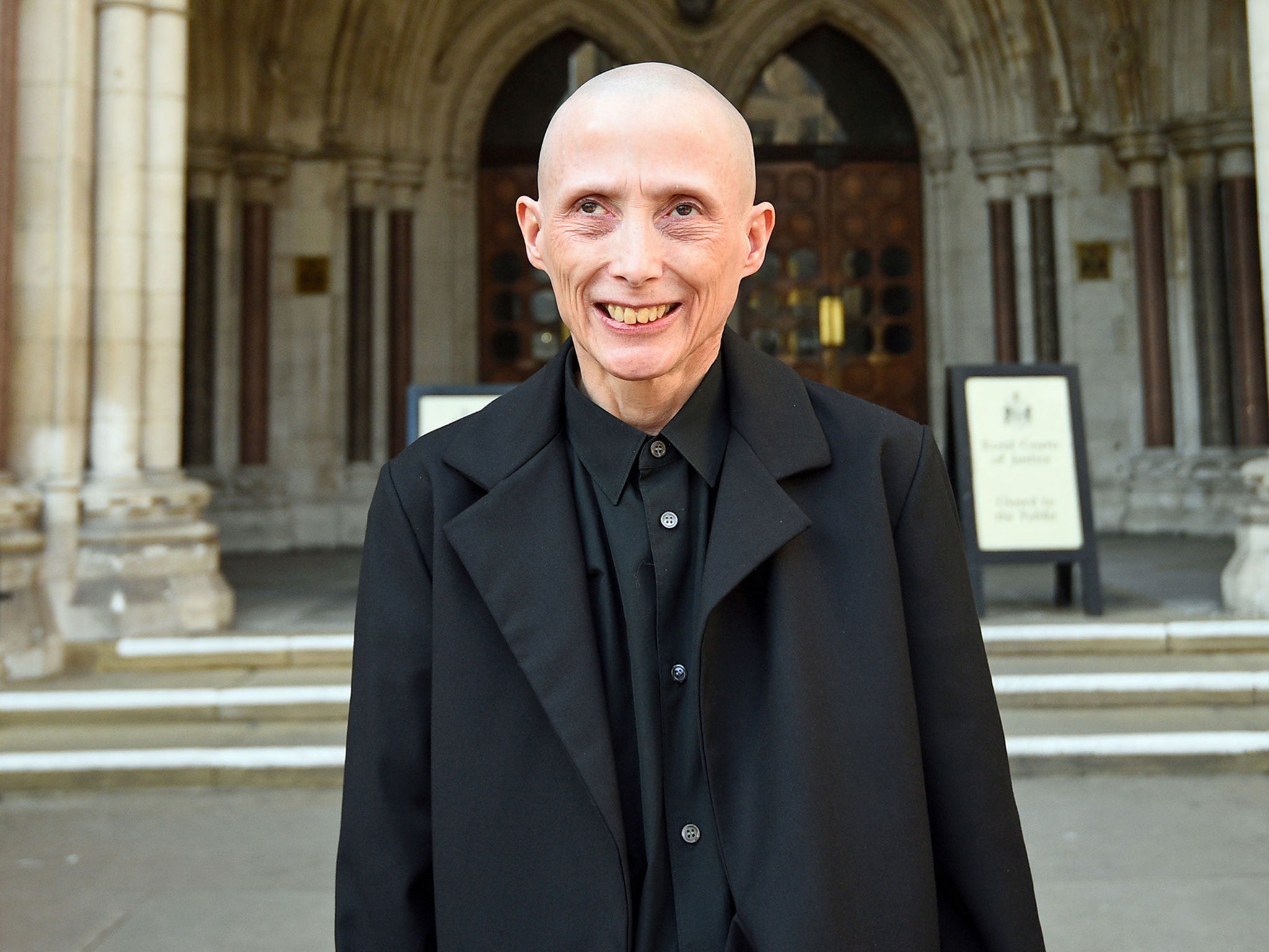 Christie Elan-Cane, who is campaigning for gender-neutral passports, outside the Royal Courts of Justice in London.