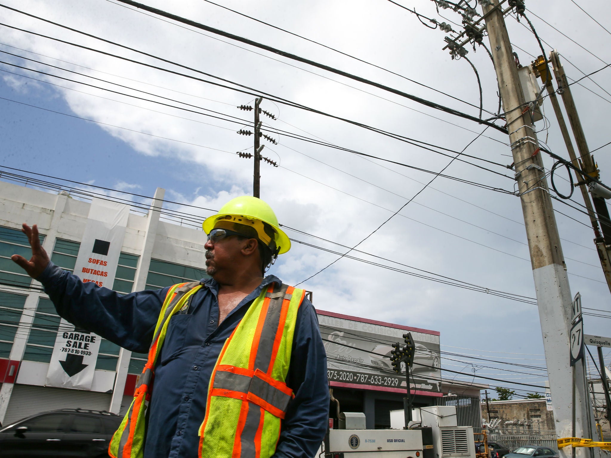 An employee of the Puerto Rico Electric Power Authority during repair work on power lines affected by Hurricane Maria in San Juan, Puerto Rico