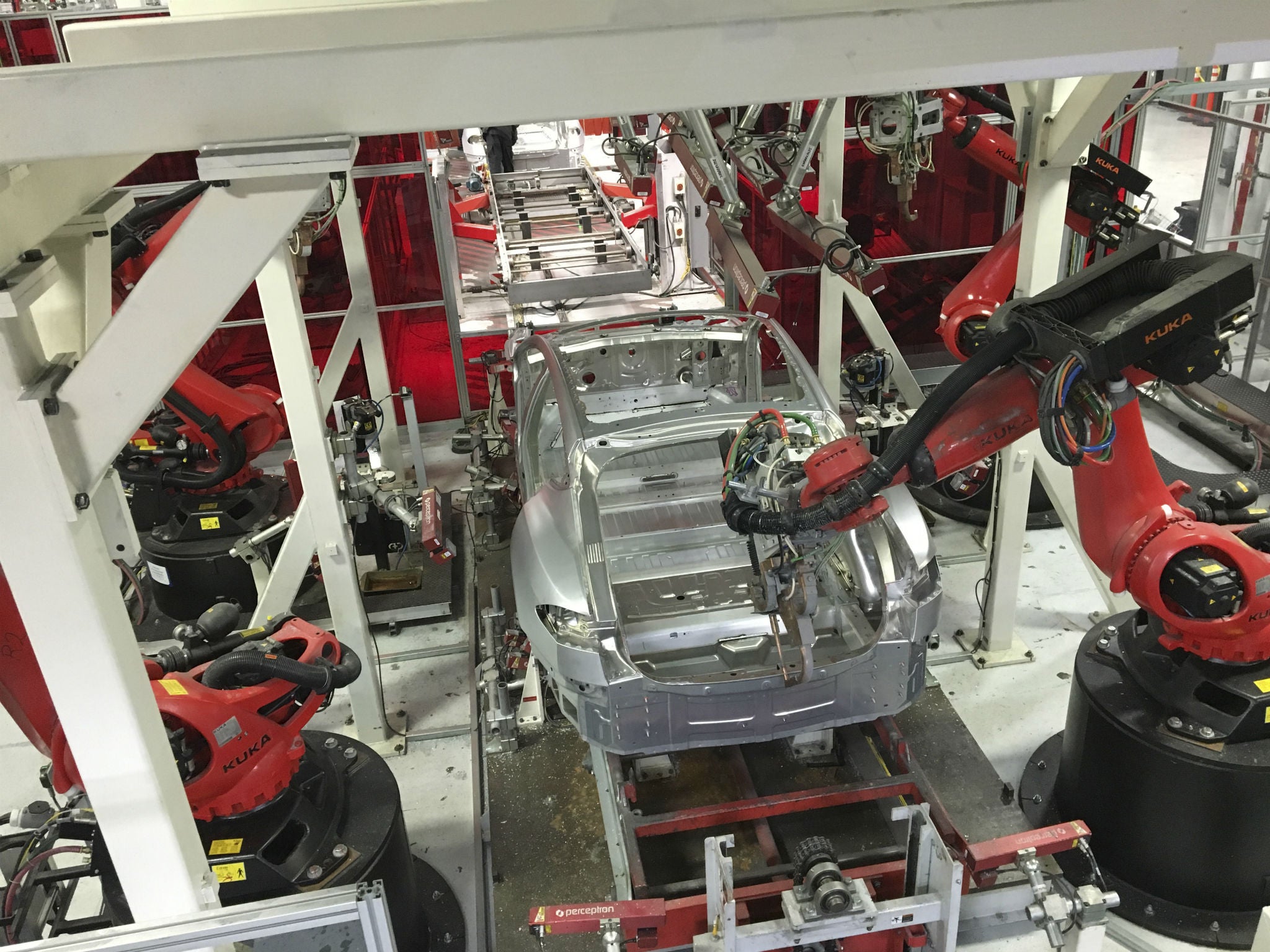 Tesla vehicles are being assembled by robots at Tesla Motors Inc factory in Fremont, California