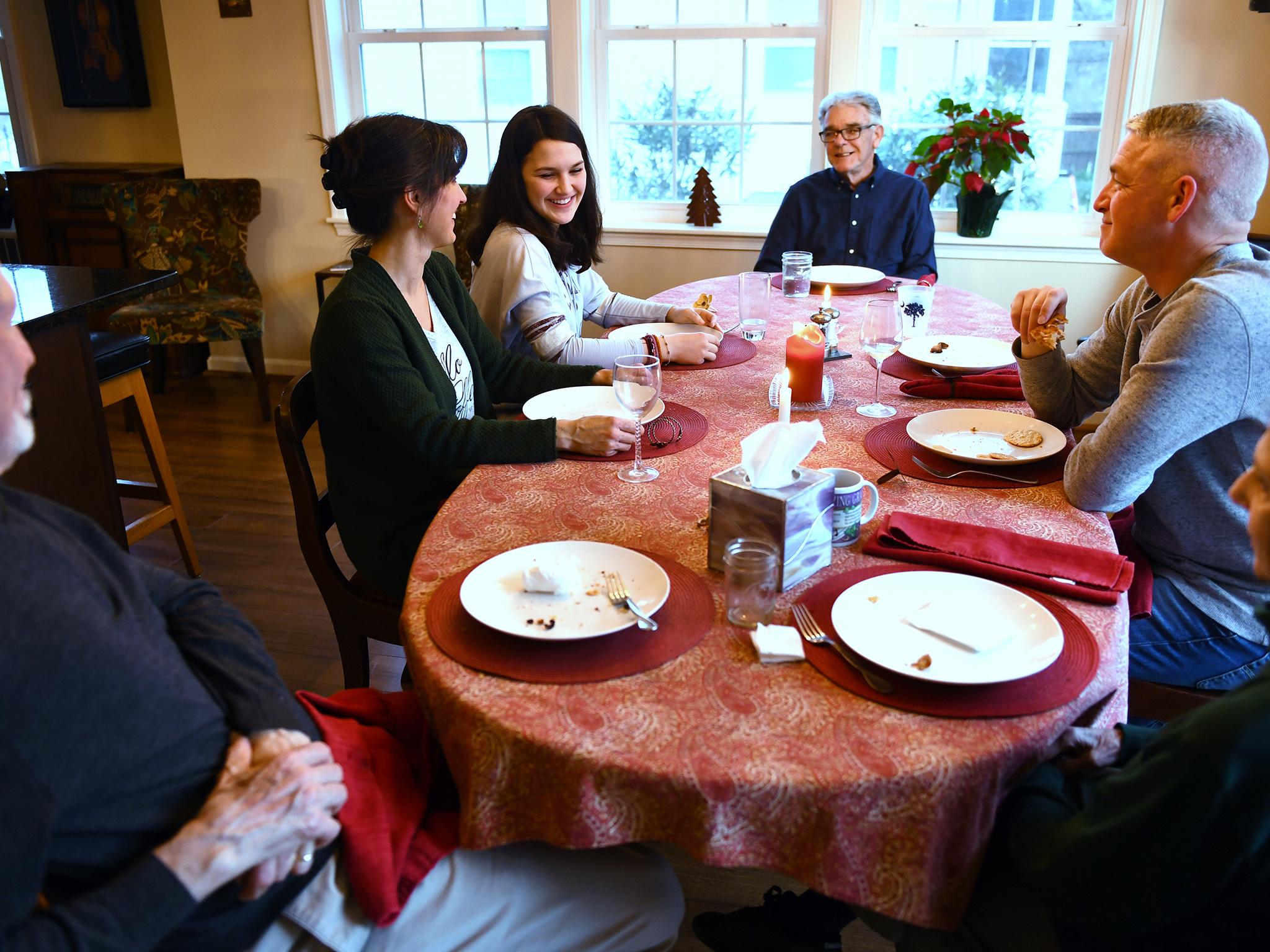 Three generations enjoy nightly meals around the dining room table