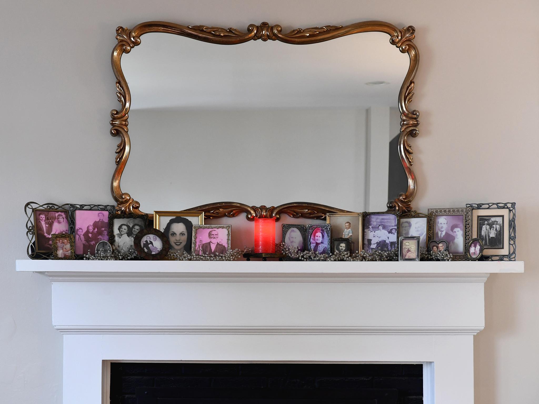 &#13;
Family photos line the mantel of the Gibbs/Smith household in Arlington&#13;