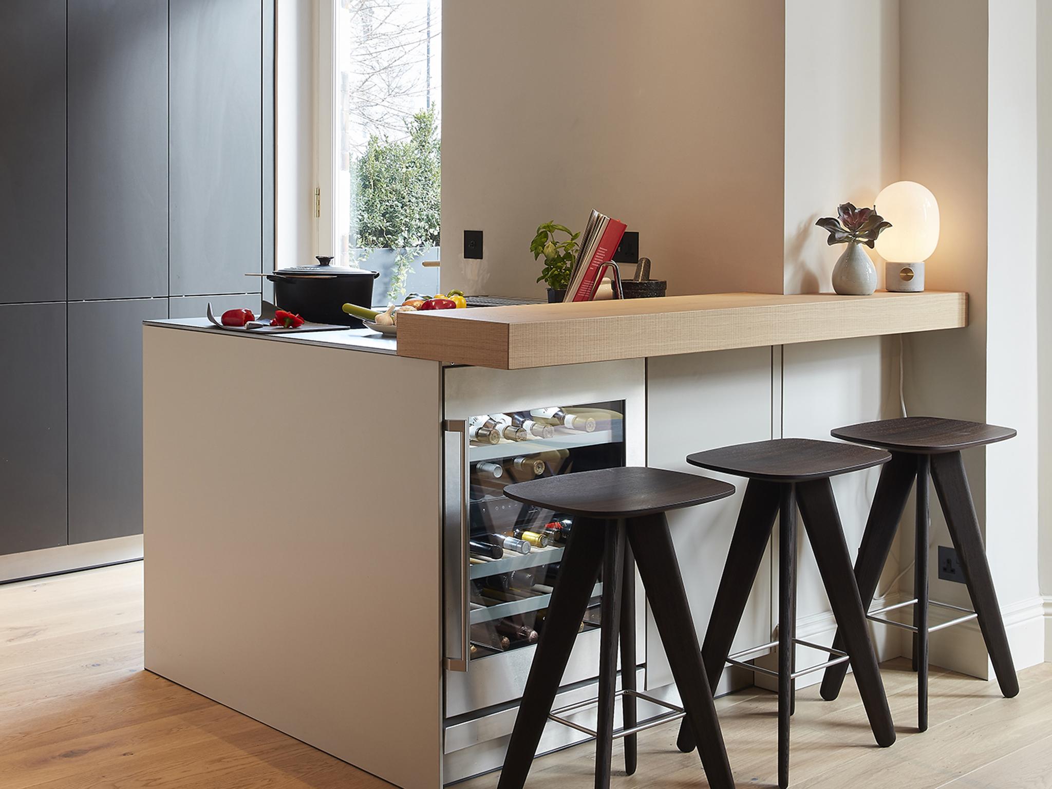 The island counter is the modern kitchen’s answer to the reversal of traditional, formal dining