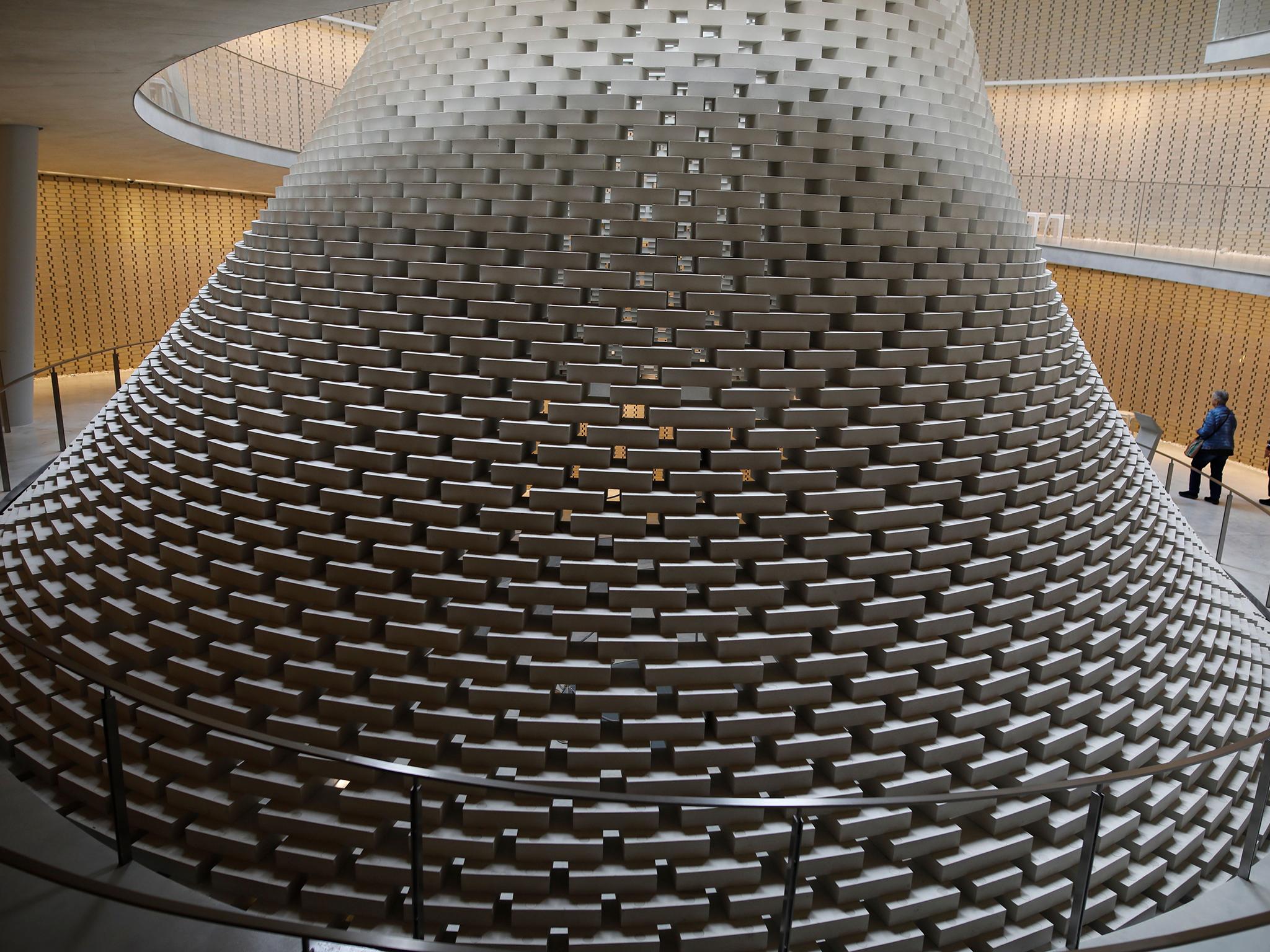 &#13;
A funnel-shaped formation of bricks, each commemorating a fallen solider, opens the hall to the sky (AFP/Getty)&#13;