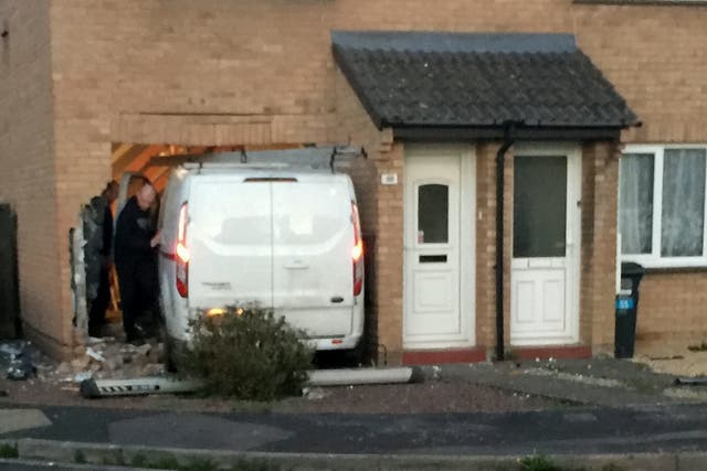 A van crashed into the front of a house in Somerset on Wednesday, killing a 90-year-old woman inside