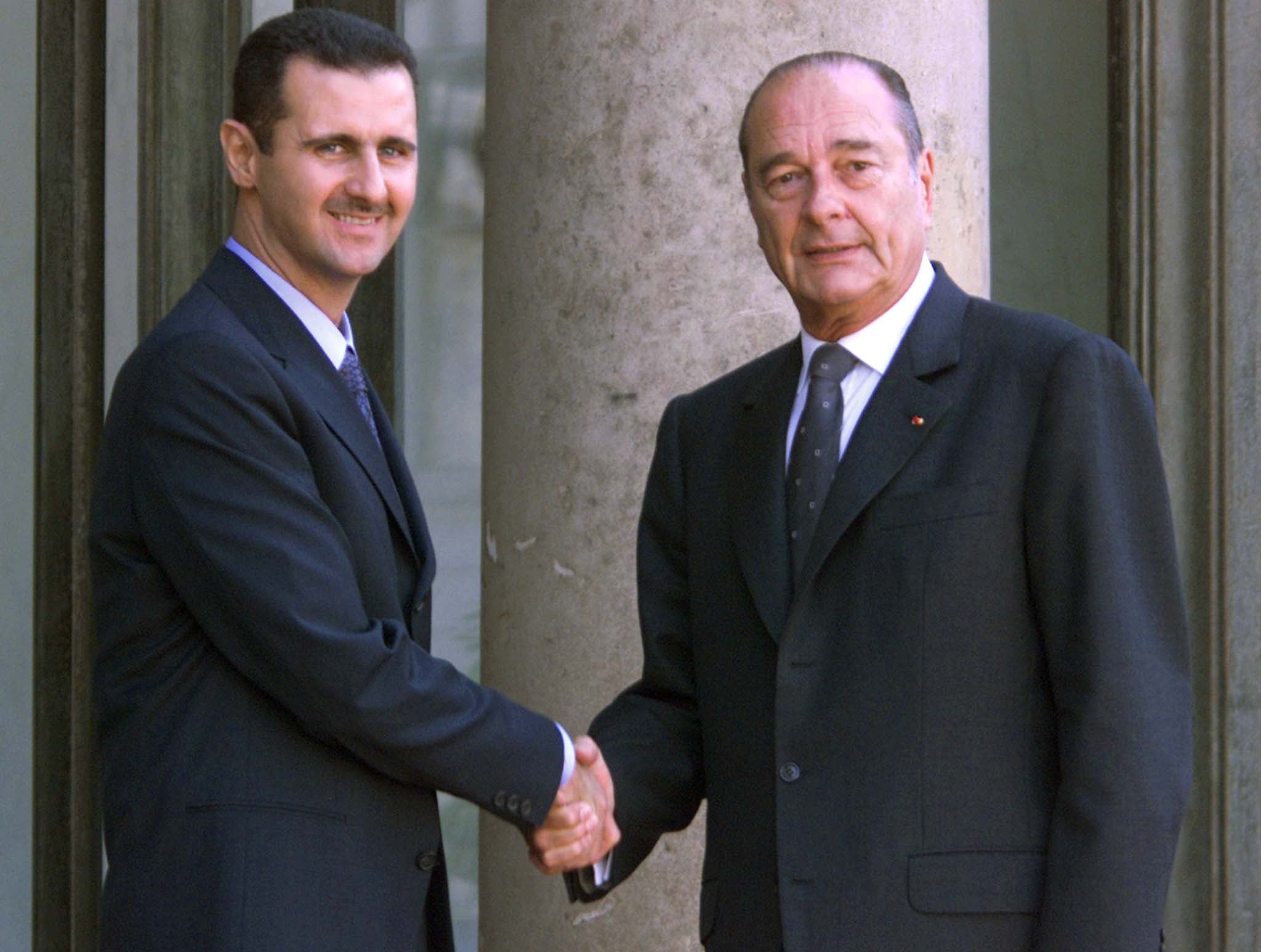 Syrian president Bashar al-Assad is greeted by former French president Jacques Chirac in 2001