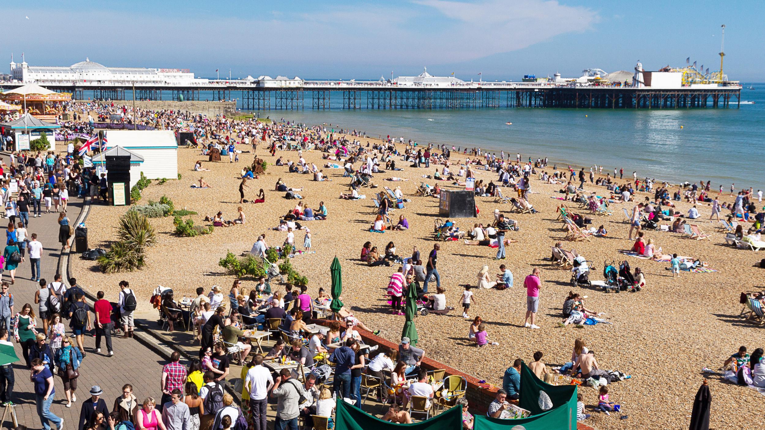 Weekenders bask in the sun?on?Brighton beach
