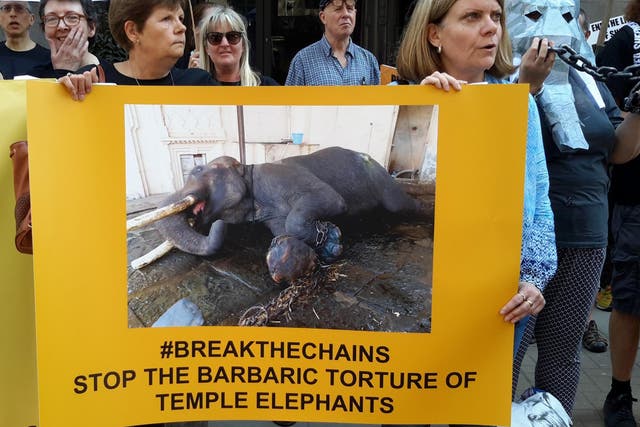 Campaigners held up banners reading #breakthechains at the Indian High Commission