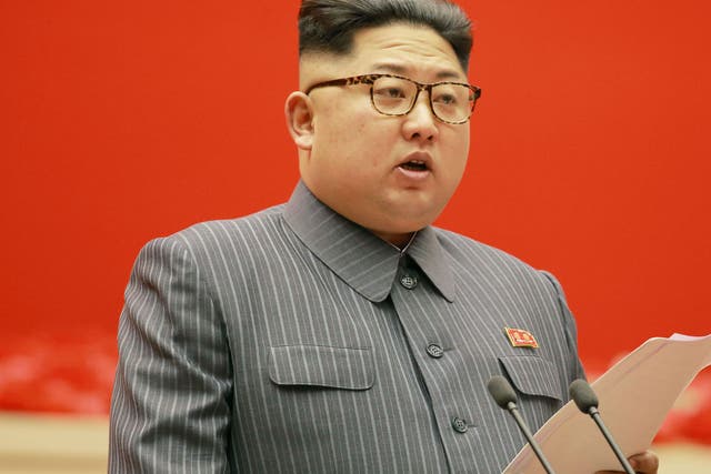 North Korean leader Kim Jong-un gives opening remarks at a party meeting in Pyongyang